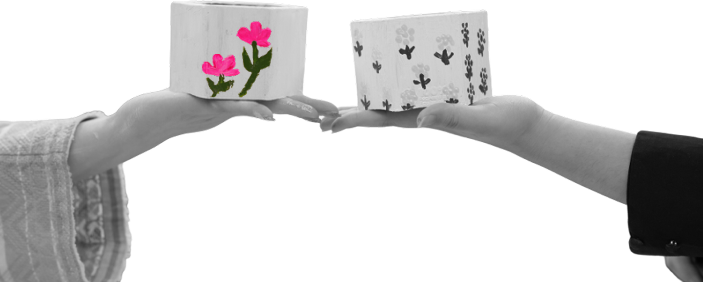 Hands holding painted blocks